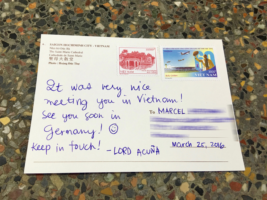 Sending a postcard at Saigon Central Post Office