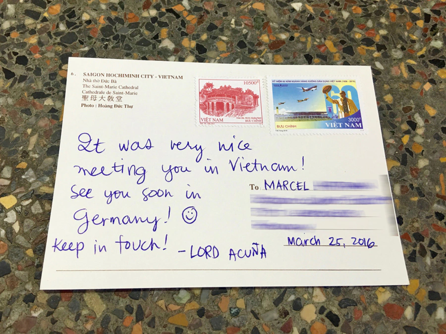 Sending a postcard at Saigon Central Post Office