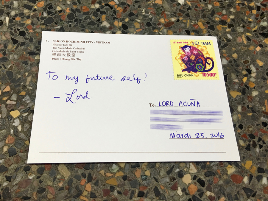 Sending a postcard at Saigon Central Post Office