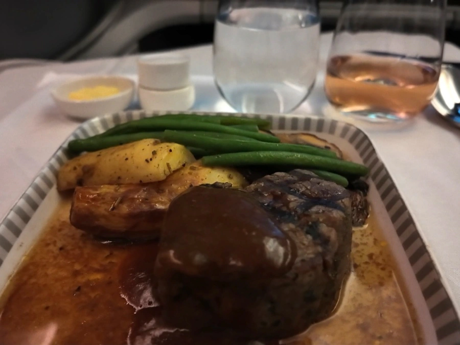 Singapore Airlines Business Class main course | char-grilled Australian Black Angus beef fillet with veal jus, roasted potatoes, beans, and portobello mushrooms