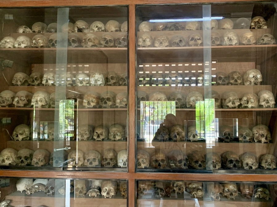 Skulls bones display Building B Tuol Sleng Genocide Museum